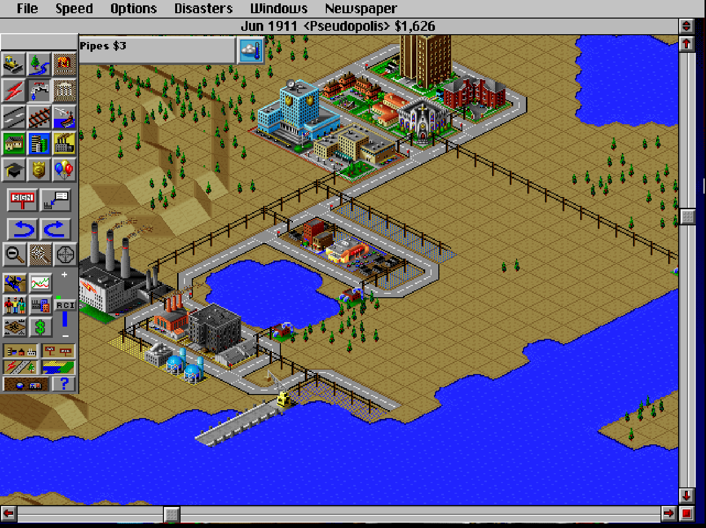 Auf einem Screenshots aus dem Computerspiel 'Sim City 2000' ist in alter Computergrafik eine Stadt am Rande eines Gewässers zu sehen.